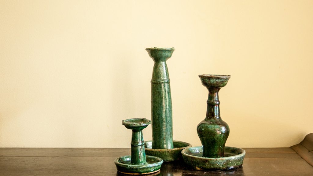 Chinese ceramic turquoise candle holders in different sizes in a weathered state