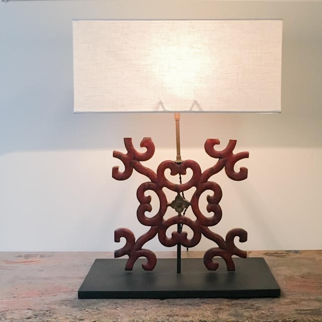 Red wooden decoration as table lamp