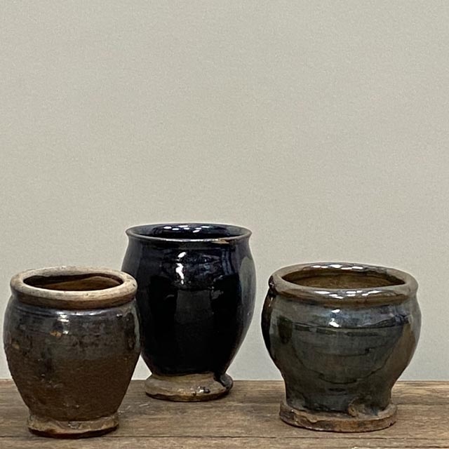 Small antique black pots