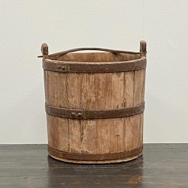 Vintage rustic wooden water bucket.