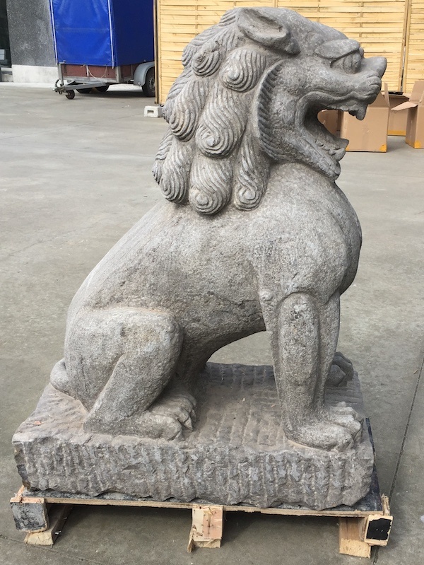 Antiquated stone Chinese lion statue