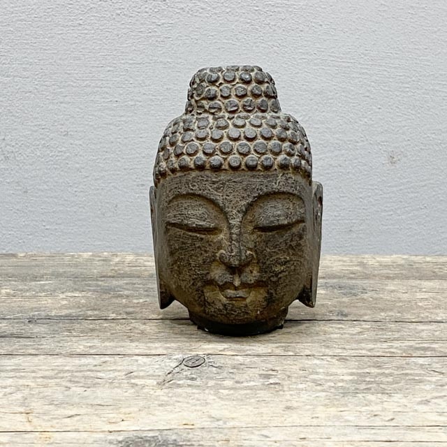 Small stone Buddha head statue