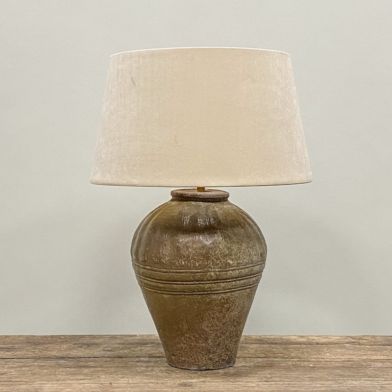 Small olive green storage jar as table lamp