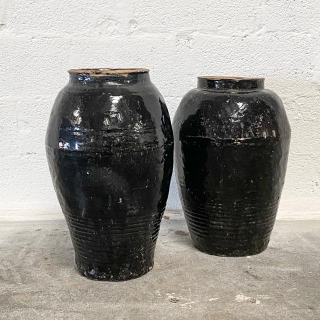 Tall black antique jars