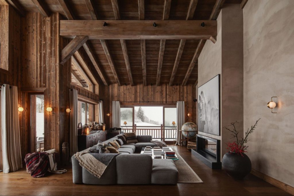 Cozy interior of Chalet Nê featuring pillars, carpets, sideboards, baskets and pots from The Silk Road Collection